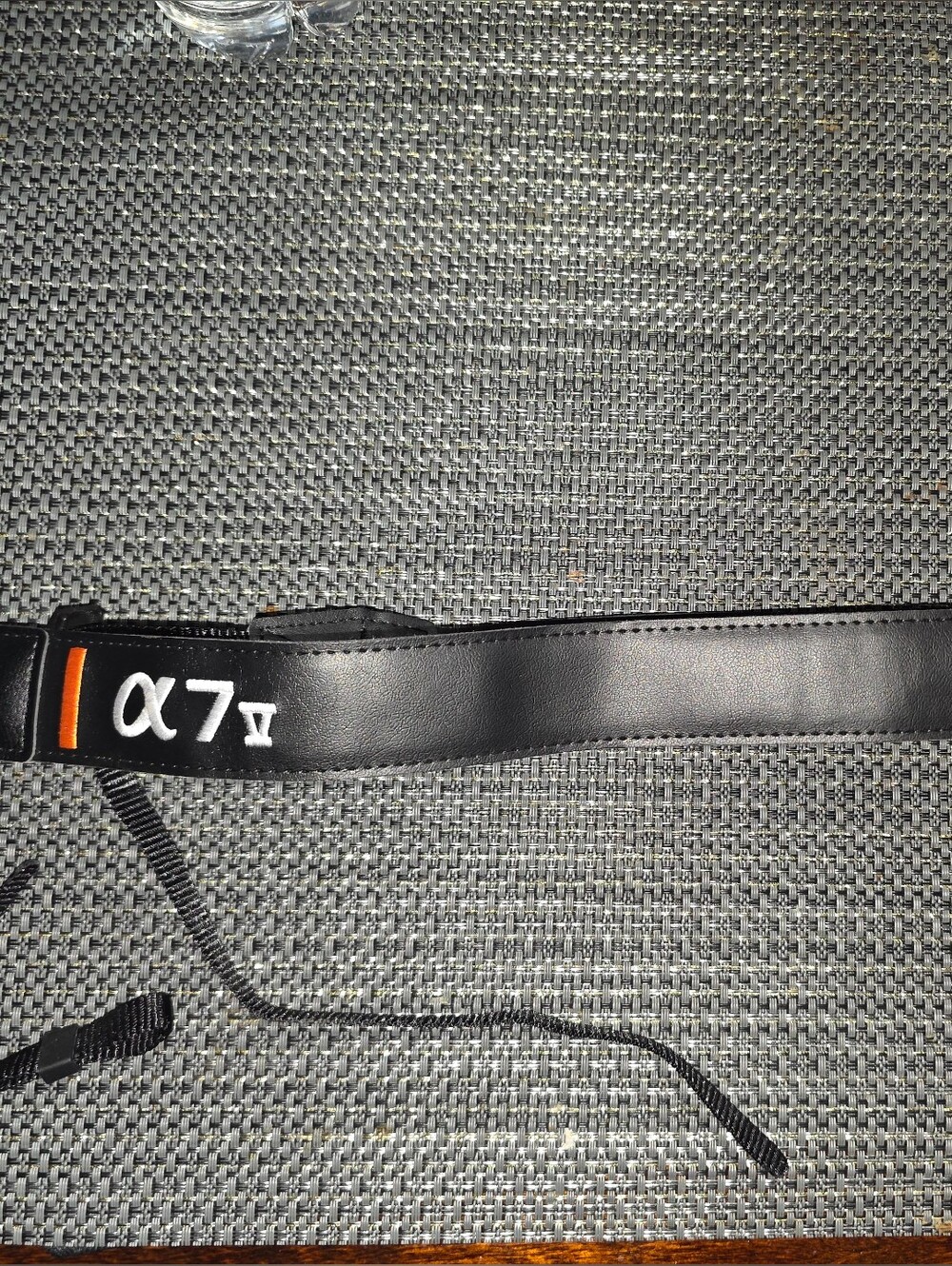Sony Black Camera Neck Strap with Orange Accent and White Logo